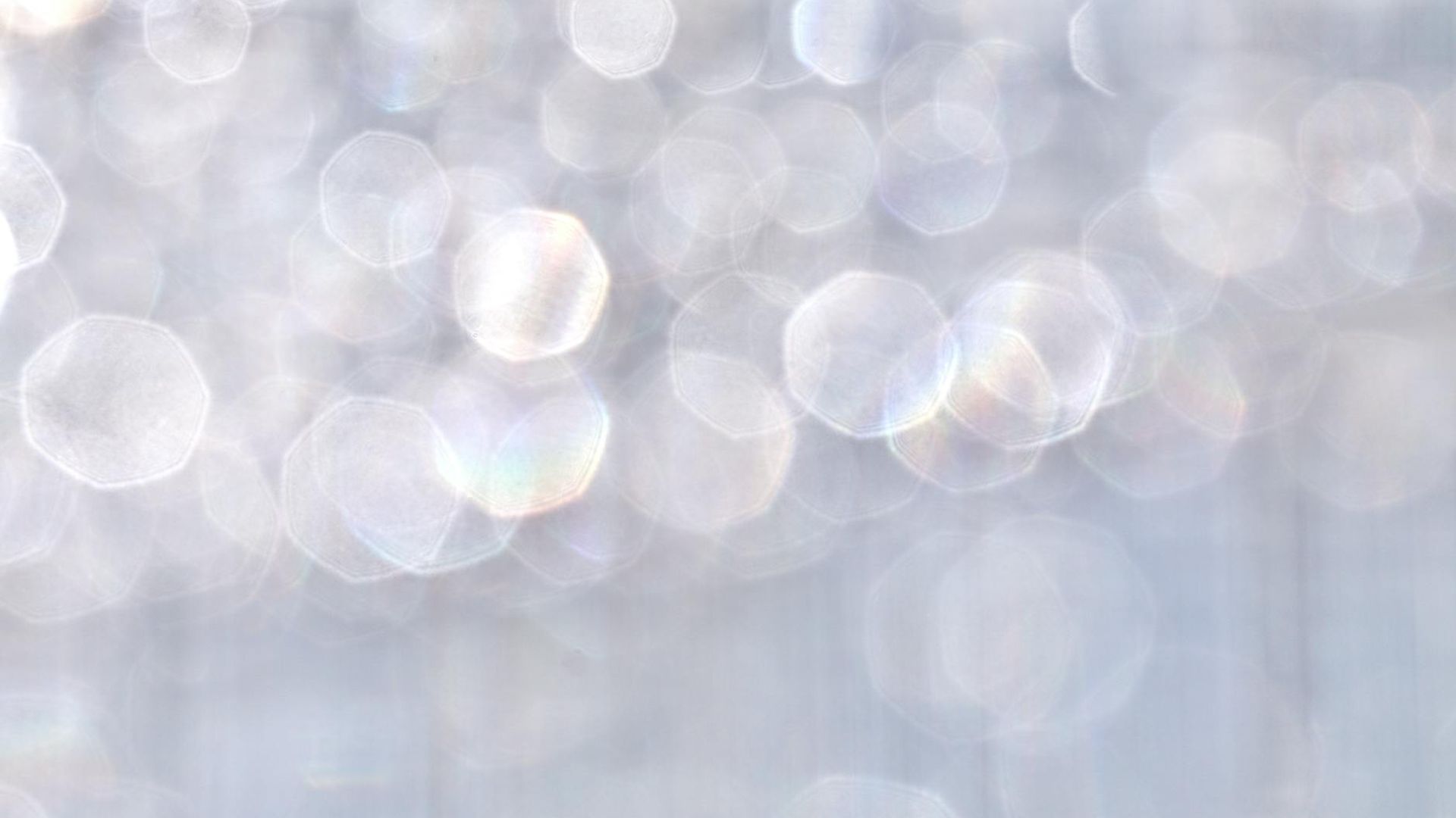 Calm abstract background with gentle light flares.